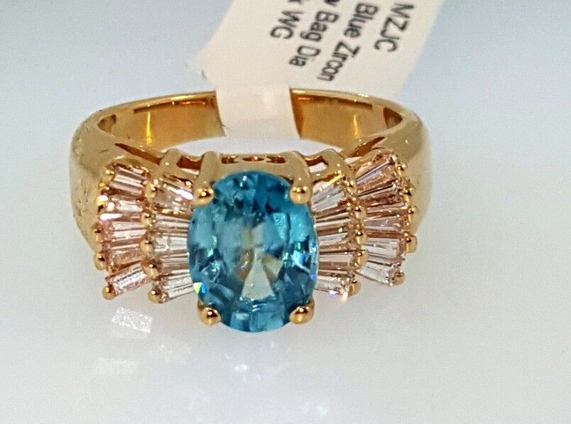 OVAL BLUE ZIRCON and BAGUETTE DIAMONDS RING 2.12 ctw, 14k Yellow Gold, Size 4.75