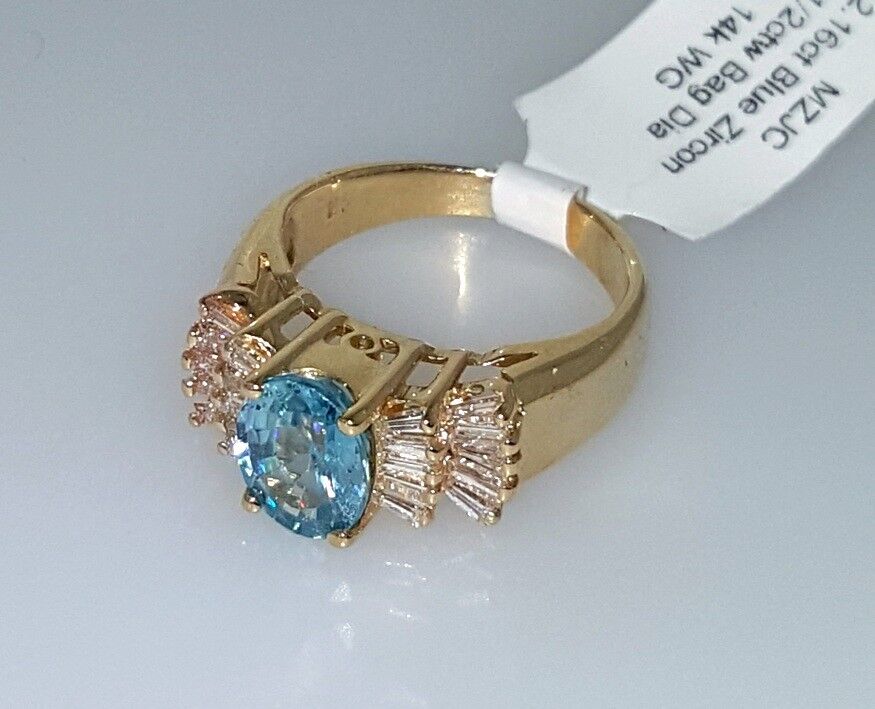 OVAL BLUE ZIRCON and BAGUETTE DIAMONDS RING 2.12 ctw, 14k Yellow Gold, Size 4.75